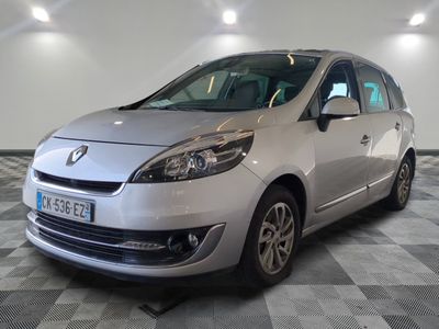 a picture of a silver car parked in a showroom