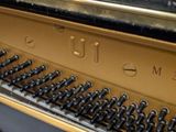 a close up view of a piano with the keys missing