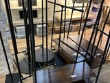 a staircase with a metal railing and wooden steps