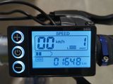 a close up of a bike with a speedometer on the handlebar