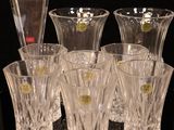 a lot of glasses that are sitting on a table