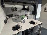 two chairs at the table in this modern kitchen