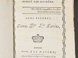 an open book with a picture of a crown on top of it