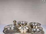 a lot of silver dishes on the table