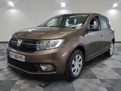 the brown dacia is parked in a room with a checkered floor