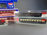 three model trains sitting next to each other on a table