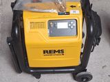a yellow and black portable air compressor on the ground