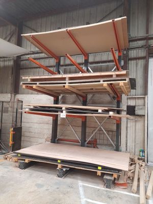 a lot of shelves that are stacked up in a warehouse