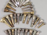 a lot of brass bells that are arranged in a circle