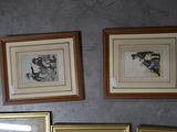 three framed pictures hanging on the wall above a toilet