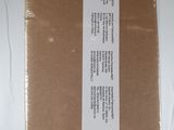 a box that has a label on it on a bed