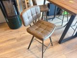 a chair that is sitting in front of a table