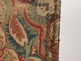 a close up of a piece of fabric with beads on it