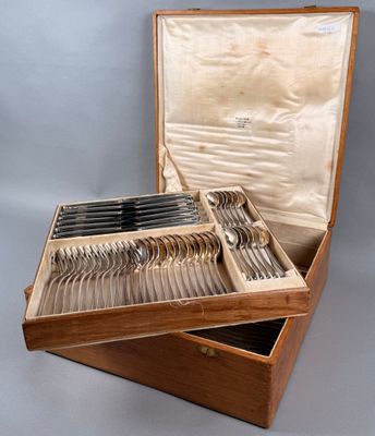 a wooden box with a set of silverware in it