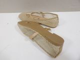 pair of women ' s shoes on a white surface with a white background