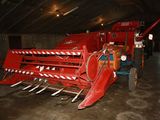 a large red machine that is parked in a garage