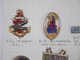 many different types of badges displayed on a piece of paper