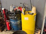 a yellow barrel sitting next to a yellow trash can
