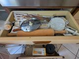 a drawer full of kitchen utensils and cooking utensils