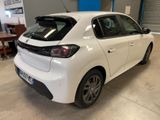 the rear end of a white car parked in a garage