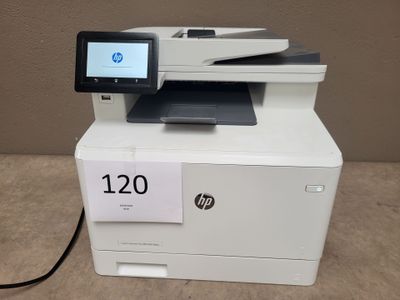 the printer is sitting on top of the table with a price tag on it