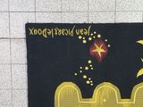 a painting of a star and a fence on the wall