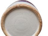 an image of a close up of a white and purple vase