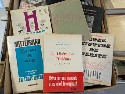 many books that are in a box on the table