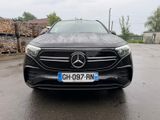 the front of a black mercedes car parked in a parking lot