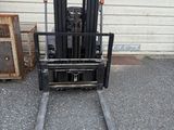 a forklift that is parked in front of a building