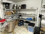 a room that has a lot of shelves and a chair in it
