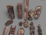 an image of a group of wooden carvings on a gray surface
