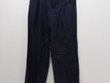 a close up of a pair of black pants hanging on a wall
