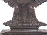 a statue of an eagle on a pedestal on a white background