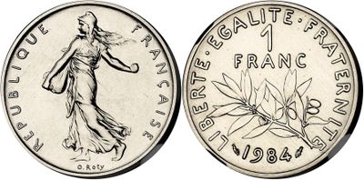 a coin with the image of a woman in a dress on it