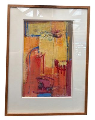 framed painting of a yellow and red abstract painting in a white frame