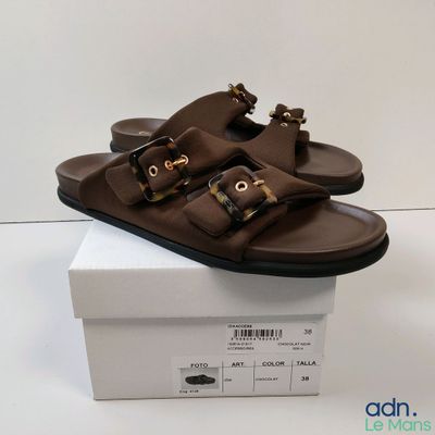 men ' s brown leather sandals with buckles on top of a white box