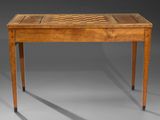 a wooden table with a chess board on top of it