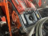 a picture of a pile of tools and equipment in a garage