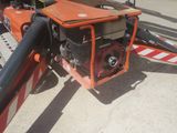a small engine on the back of a tow truck