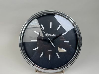 a clock that is sitting on a white table
