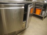 a stainless steel oven that is open in the kitchen