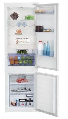 an open refrigerator with a lot of food inside of it