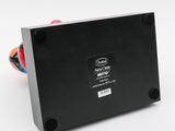 a close up of a black electronic device on a white surface