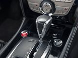 a close up of a car ' s interior with a gear stick