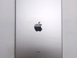 an apple ipad sitting on top of a white table next to a white wall