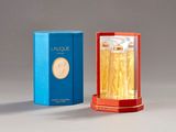 an image of a bottle of perfume next to a box of perfume