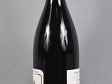 a bottle of wine that is sitting on a table