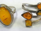 two rings with amber and amber stones on them