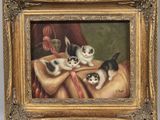 an image of a painting of kittens on a table with a cloth